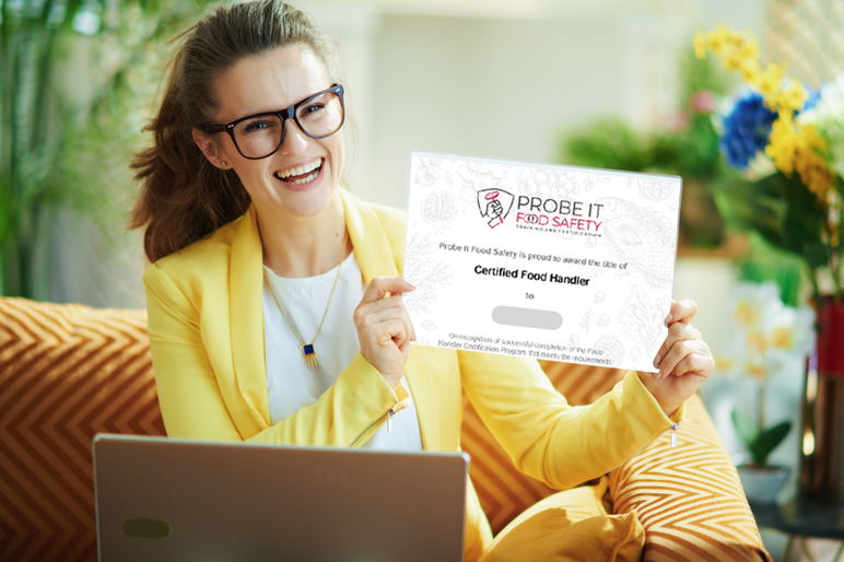 A certified food handler holding her Probe It Food Safety certificate